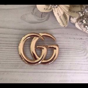 Gold G inspired brooch